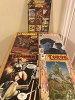 Photo showing the front covers of five comics including Elfquest, Angel, Samuree, Turok Dinosaur Hunter, and a Wizard Anime issue.