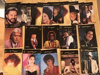 Photo showing 20 Country Music collector cards laid out in a grid, featuring images of various well-known country artists including Mel Tillis, Bill Anderson, Charley Pride, and Dolly Parton.
