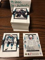 Stack of stacked hockey cards from 1999-2000 SP Authentic with handwritten box label reading '99-2000 SP Authentic' and top card showing goalie player.