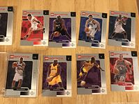 Photo showing LEGO basketball cards featuring Tim Duncan, Shaquille O'Neal, Kobe Bryant, and other players in LEGO sports style.