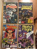 Four Marvel comic books laid out showing front covers: Nomad Dead Man's Hand, Midnight Sons Nightstalkers Special Collector's Edition, Ravage 2099, and Alpha Flight.