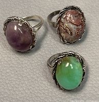 Top view of the three sterling silver rings with stones showing color and setting details.