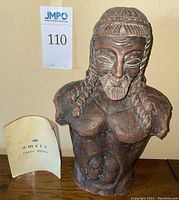 Front view of Omero Bordo bust with original Italian booklet beside it.