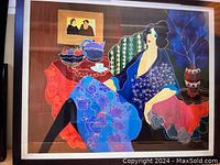 Full frontal view of the framed artwork showing stylized woman, fruit still life, signature and numbering