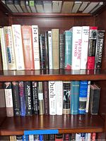 Shelf of history and biography books including titles on U.S. presidents, German history, and political memoirs; books show wear and age consistent usage.