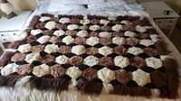 Alpaca blanket laid out flat on bed showing full pattern and color scheme.