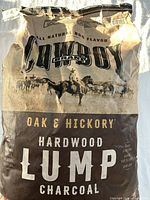 Photo of an unopened bag of Cowboy Brand Oak & Hickory Hardwood Lump Charcoal