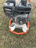 Close view of Briggs & Stratton engine housing showing CR950 label and recoil starter