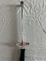 Full view of torque wrench showing metal shaft, black handle, and measurement scale in pounds.