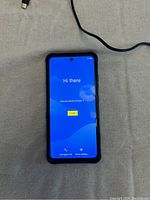 Front of Umidigi Bison phone powered on showing start screen.