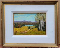 Framed oil on board painting showing a colorful landscape with birch trees, lake, and mountains.