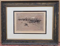 Framed antique etching with visible artist signature, landscape showing cityscape with boats and buildings on waterfront.