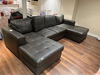 Full view of 3-piece sectional sofa assembled on basement floor