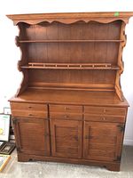 Front view of maple hutch with drawers and doors closed