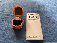 Ring in hinged presentation box alongside MaxSold notes card