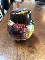 Front view showing Moorcroft label and overall floral decoration