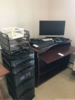 Photo shows full office desk setup with HP monitor, keyboard, mouse, LG Blu-ray player, and stacked file organizers beside desk.