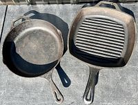 Photo showing the tops of two cast iron pans: a regular round skillet and a square grill pan