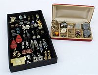 Tray of assorted costume earrings and a box with pendants and other jewelry pieces