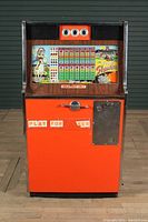 Full front view of the Sweet Shawnee arcade game machine showing overall cabinet, coin slot, handle, and play for yes text.