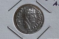 Close-up of obverse side showing Emperor Antoninus Pius profile and inscriptions.
