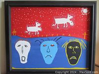 Full view of framed painting showing red sky, white dogs, blue ground with three faces