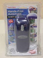 Front view of the hands-free automatic can opener in original packaging, showing device color, packaging text and key features.