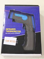 Photo of the infrared thermometer in its box showing the device and branding on the package front.