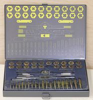 Full view of the tap and die set inside the metal case showing tools and layout.
