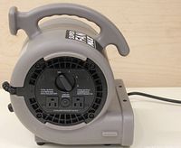 Rear panel of Lasko Super Fan Max showing 3-speed dial and two 115V power outlets with circuit breaker.