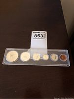 Plastic case of six Canadian centennial coins including a penny and larger denominations.
