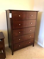 Front view of highboy showing all six drawers and finish