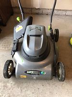 Front and top view of Earthwise electric lawn mower 18 inch with grass catcher attached and branding visible.