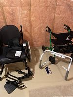Wheelchair, walker and toilet safety rail arranged on basement floor