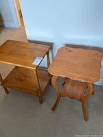 Both small solid wood occasional tables side by side showing overall condition and structure.