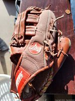 Rawlings baseball glove showing front design with logo patch and fabric mesh back