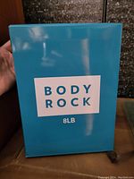 Blue box with Body Rock logo and 8lb text