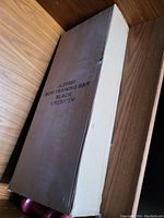 Photo of unopened rectangular cardboard box labeled 'Bow Training Bar Black 1 PCS/CTN'.