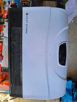 Top view of Heat Storm Phoenix Smart Heater with visible Heat Storm logo on white panel and black vents.