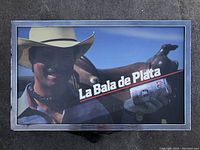 Front view of the Coors Light La Bala de Plata light up beer sign showing the cowboy holding the beer can with visible branding and text.