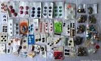 Full lot photo showing the assortment of carded and loose vintage buttons in various colors and styles