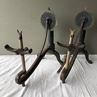 Pair of vintage ophthalmologist peripheral vision tools, tripod base with adjustable arms and rotary dials