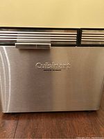Front view of the stainless steel bread maker showing the Cuisinart logo and convection breadmaker branding.