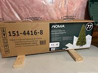 Original packaging box showing model number, brand, and specifications including 6.5 ft height and 46 inch diameter.