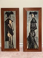 Front view of both Bernard Buffet art prints depicting stylized matadors, showing teak mounted frames.