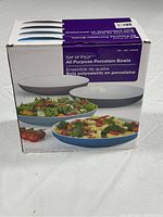 Box showing branding and contents image of four all purpose porcelain bowls with serving suggestions on box