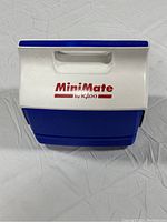 Top view of the white and blue Igloo MiniMate cooler with handle and logo.