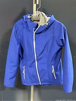 Front view of the blue Athletic Works women's jacket showing the zipper closure, hood with adjustable toggles, and zippered pockets.