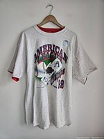 Front view of the gray vintage Toronto Blue Jays t-shirt showing the American League Champions 1992 graphic with baseball and flags on front.