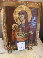 Full front view of the vintage hand painted wooden icon depicting Mary and Child Jesus with noticeable wear and cracks on the aged wood surface.